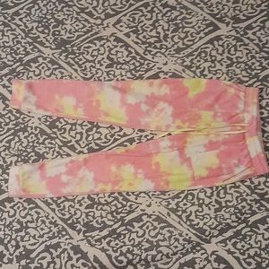 I am selling a medium size, yellow pink and white stitch and pine sweat pants